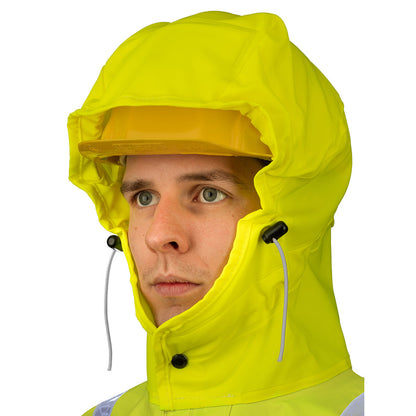 Person wearing a hard hat underneath the Guy Cotten Isoflash waterproof high visibility jacket with the Magic Hood